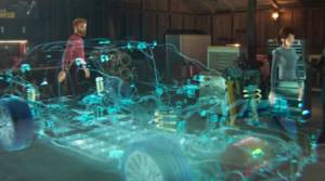 Avatares de Microsoft Mesh observando un modelo de coche en tres dimensiones, mostrando el trabajo colaborativo