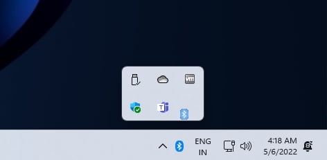 Dragging the Bluetooth icon from the Windows 11 system tray
